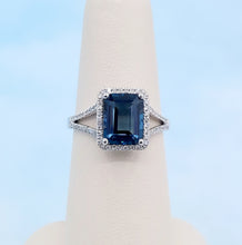 Load image into Gallery viewer, Emerald Cut London Blue Topaz Ring with Diamond Halo &amp; Split Shank - 14K White Gold