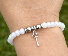 Load image into Gallery viewer, Key To New Beginnings Charm Bracelet - TJazelle HELP Collection