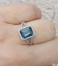 Load image into Gallery viewer, Emerald Cut London Blue Topaz Ring with Diamond Halo &amp; Split Shank - 14K White Gold