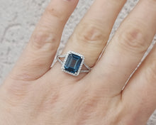 Load image into Gallery viewer, Emerald Cut London Blue Topaz Ring with Diamond Halo &amp; Split Shank - 14K White Gold